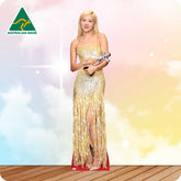 Woman in a gold dress holding an award with 'Australian Made' logo in the corner.